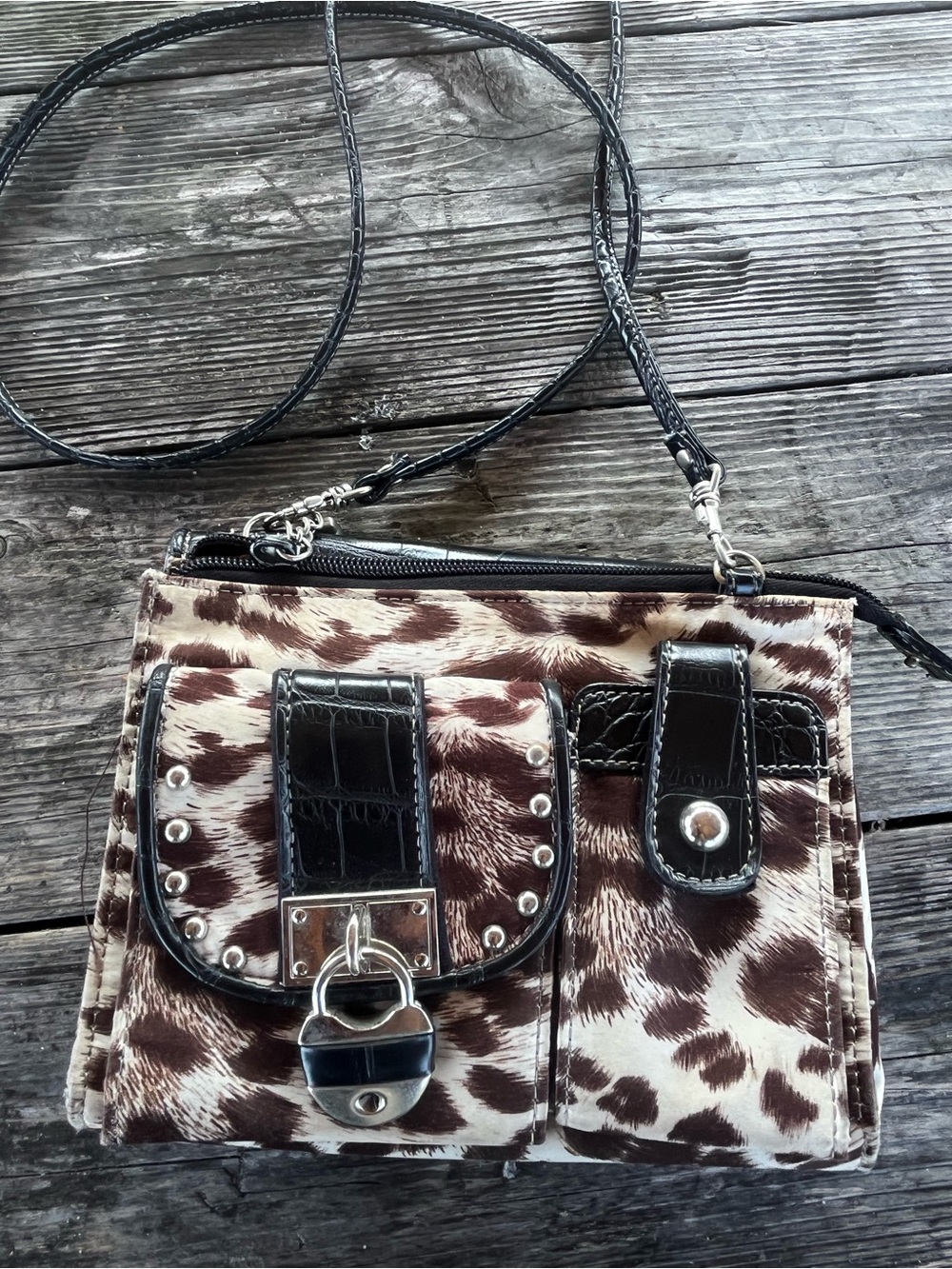 KATHY VAN ZEELAND  Brown and White Cowhide Pattern Crossbody Bag with lock charm